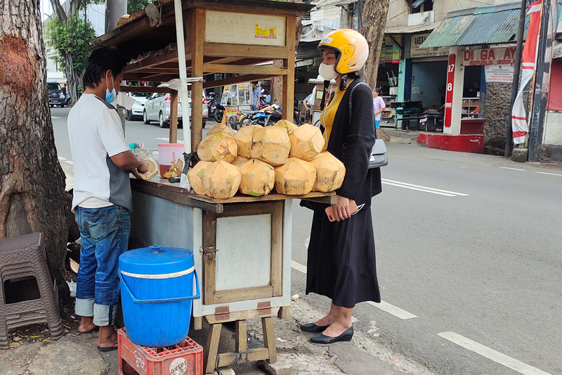 Coconut Drink Street Vendor by Febe Victoria, Participant of World Coconut Day 2021 Competition